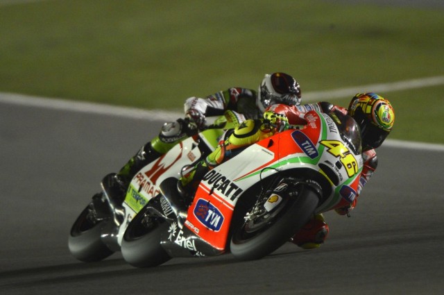 2012 MotoGP : Commercial Grand Prix of Qatar,Valentino Rossi, Ducati Team trailed by Hector Barbera, Pramac Racing Team