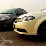 Pearl White Chevrolet Optra Magnum 2.0 LT and Medium Grey Fiat Punto 1.3 MJD