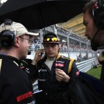 Kimi Raikkonen in discussion with the Lotus F1 Team at F1 2012 Malaysian Grand Prix