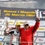 Ricardo Moretti celebrates his podium finish at Mugello with Muffadal Choonia in the 125GP Italian Championship