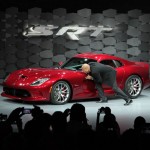 SRT Brand and Motorsports President and CEO Ralph Gilles kisses his pride and joy, the 2013 SRT Viper GTS, at the New York International Auto Show reveal
