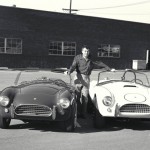 Carroll Shelby poses with his new 1964 production Cobra and his new Cobra race car.