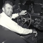 Carroll Shelby at the wheel of a new Cobra production car in 1963