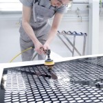 Volkswagen Golf GTI Black Dynamic : Christian Wolter polishing the sound system cover.