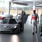 Jenson Button arrives in the prototype McLaren P1 for the unveiling of the 2013 F1 contender Vodafone McLaren Mercedes MP4-28