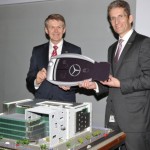 Prof.Dr. Thomas Weber (member of the Board of Management, Daimler AG and Head of Group Research, Mercedes-Benz Cars Development) hands over the key to Dr. Jens Cattarius (Managing Director and CEO of MBRDI) at the inauguration of Mercedes-Benz's largest R&D Center of Daimler outside Germany, in Bangalore.